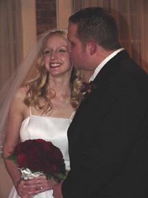 Devin the groom kissing his bride Stephanie